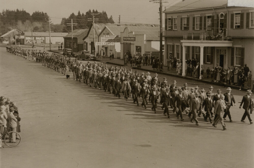 Men marching through Broadway.