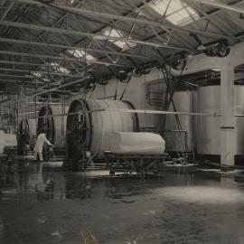 Photograph of butter and machinery with machine operator.