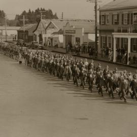 Men marching through Broadway.
